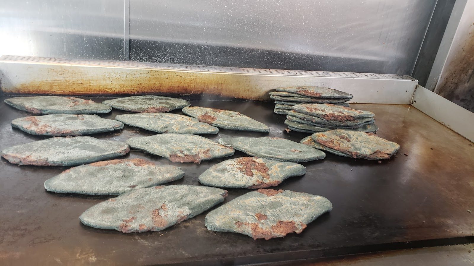 Tlacoyos on the comal
